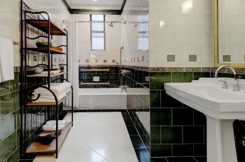 The Premium Accessible room has a large marble bathroom with an ADA compliant bathtub.