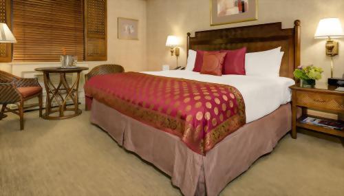 Premium Rooms with 1 King bed are approximately 275 square feet with a very spacious mattress that is approximately 76 inches wide by 80 inches long.