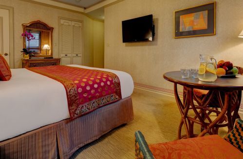 Premium Rooms with 1 King bed are approximately 275 square feet with a bistro table.